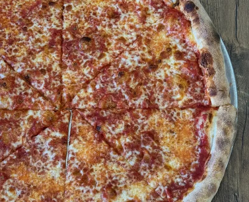 Crispy pepperoni pizza at Crustinos Pizza, baked with golden crust and rich tomato sauce.